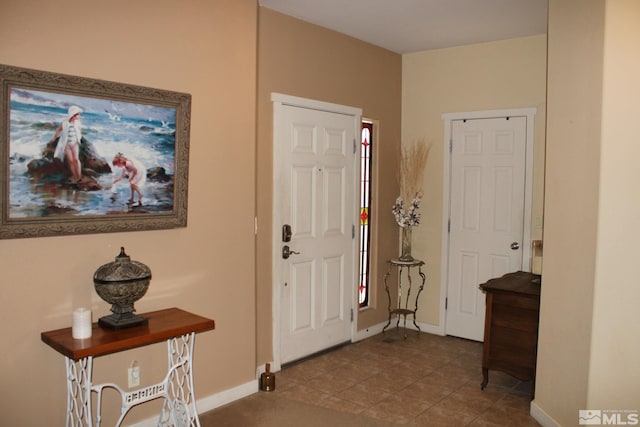 1090 Aster Ln, Fernley, NV 89408 - foyer entrance featuring baseboards and tile patterned flooring
