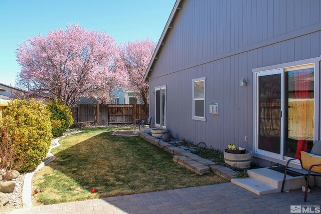 1090 Aster Ln, Fernley, NV 89408 - view of property exterior featuring entry steps and a patio