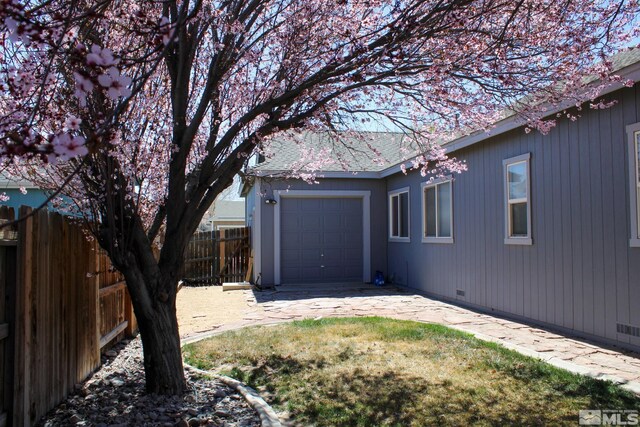 1090 Aster Ln, Fernley, NV 89408 - view of yard featuring fence and a garage