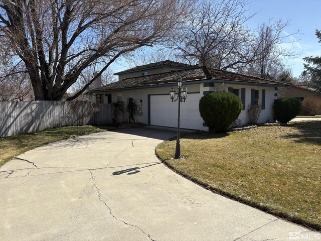 3 Comstock Cir, Carson City, NV 89703 - view of front of property with a garage, concrete driveway, and stucco siding
