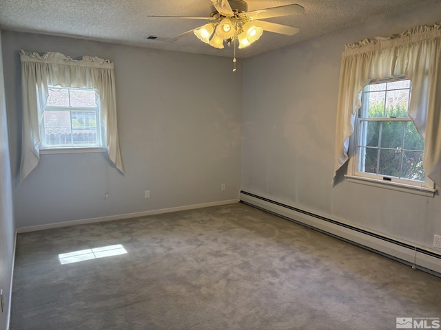 3 Comstock Cir, Carson City, NV 89703 - empty room with baseboard heating, plenty of natural light, a textured ceiling, carpet flooring, and ceiling fan