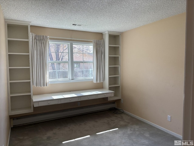 3 Comstock Cir, Carson City, NV 89703 - interior space featuring a baseboard radiator, carpet flooring, a textured ceiling, and baseboards
