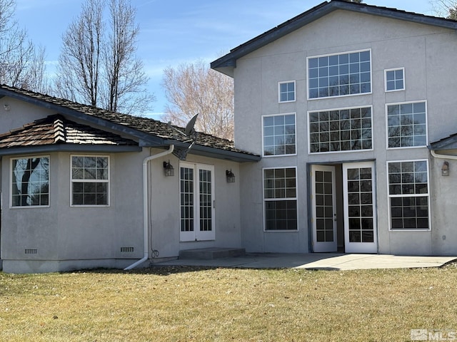 3 Comstock Cir, Carson City, NV 89703 - back of house featuring stucco siding, a lawn, crawl space, and a patio area