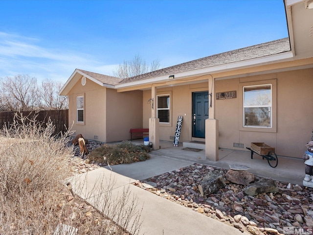 4259 Rancheria Rd, Fallon, NV 89406 - view of front of house featuring covered porch, stucco siding, and fence