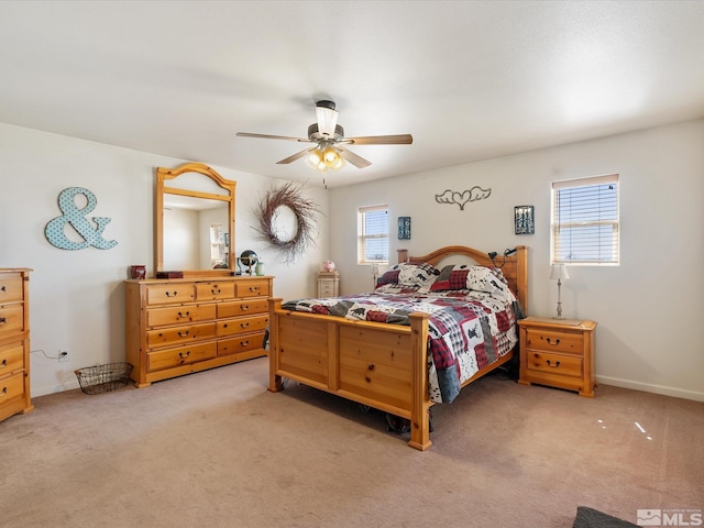 4259 Rancheria Rd, Fallon, NV 89406 - bedroom featuring multiple windows, light colored carpet, and ceiling fan