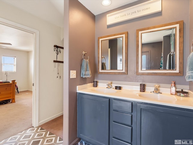 4259 Rancheria Rd, Fallon, NV 89406 - full bath featuring double vanity, ceiling fan, and baseboards