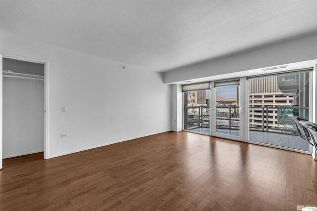 255 N Sierra St Unit 815, Reno, NV 89501 - empty room featuring wood finished floors and baseboards
