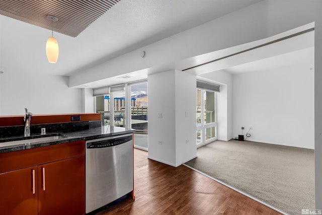 255 N Sierra St Unit 815, Reno, NV 89501 - kitchen with dishwasher, a sink, dark wood finished floors, pendant lighting, and dark stone countertops