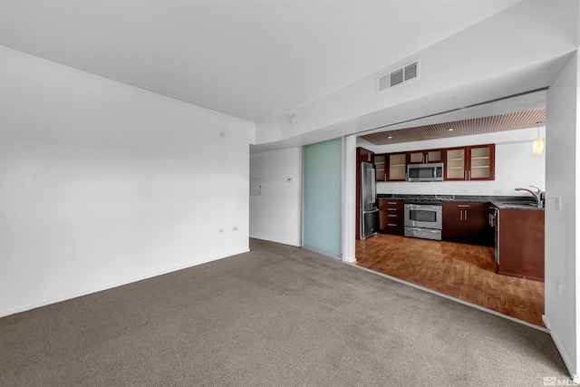 255 N Sierra St Unit 815, Reno, NV 89501 - unfurnished living room with dark carpet and a sink