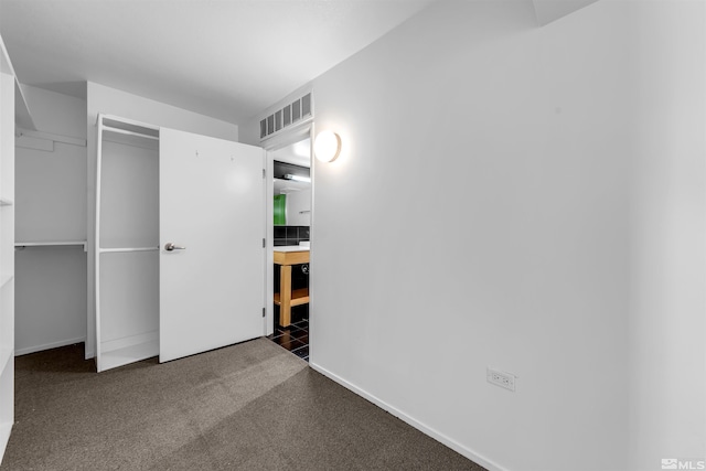 255 N Sierra St Unit 815, Reno, NV 89501 - unfurnished bedroom with baseboards, carpet floors, and a closet