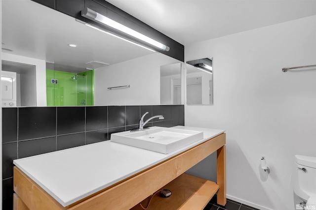 255 N Sierra St Unit 815, Reno, NV 89501 - bathroom featuring a stall shower, toilet, vanity, and tile patterned floors