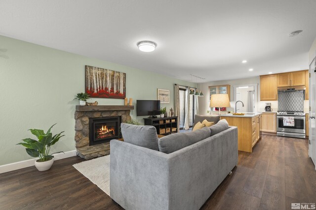136 Juanita Unit 24, Incline Village, NV 89451 - living area featuring recessed lighting, a stone fireplace, dark wood finished floors, and baseboards