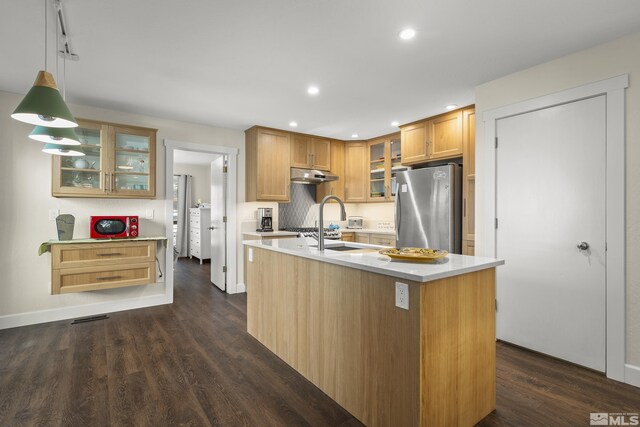 136 Juanita Unit 24, Incline Village, NV 89451 - kitchen with freestanding refrigerator, under cabinet range hood, light countertops, dark wood-style floors, and recessed lighting