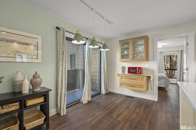 136 Juanita Unit 24, Incline Village, NV 89451 - dining space featuring track lighting, dark wood-style floors, and baseboards