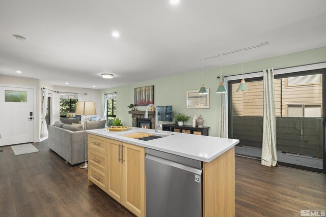 136 Juanita Unit 24, Incline Village, NV 89451 - kitchen featuring stainless steel dishwasher, a sink, open floor plan, dark wood finished floors, and light brown cabinets