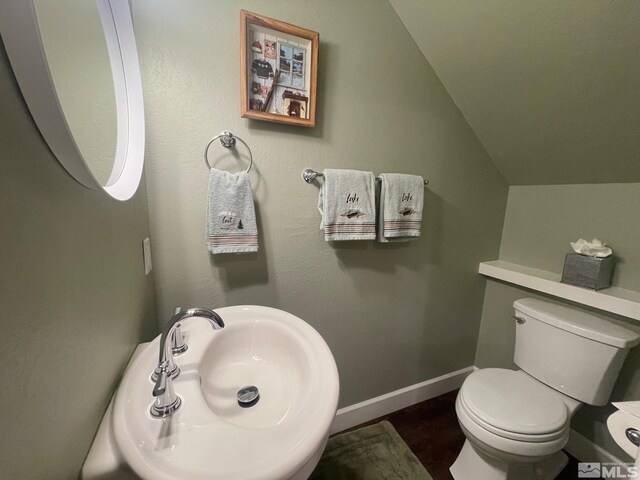 136 Juanita Unit 24, Incline Village, NV 89451 - half bath with toilet, lofted ceiling, a sink, and baseboards