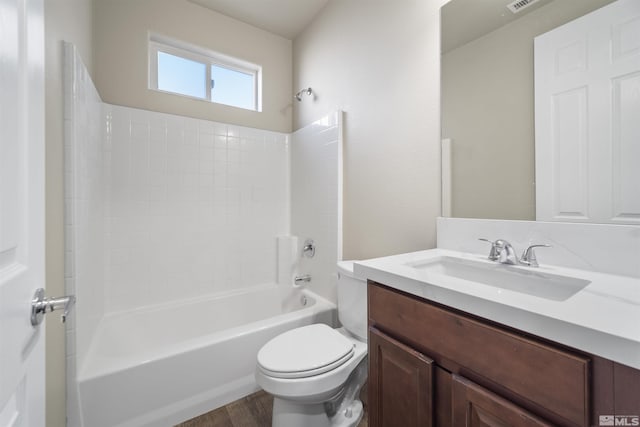 7117 Mustengo Dr, Reno, NV 89506 - bathroom with toilet, vanity, wood finished floors, and shower / bathtub combination