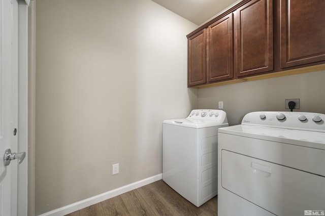 7117 Mustengo Dr, Reno, NV 89506 - washroom with cabinet space, washing machine and clothes dryer, wood finished floors, and baseboards