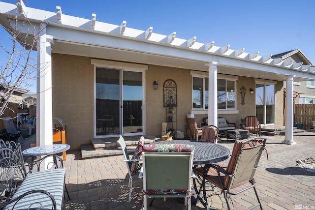 7117 Mustengo Dr, Reno, NV 89506 - rear view of property featuring a patio area, stucco siding, and fence