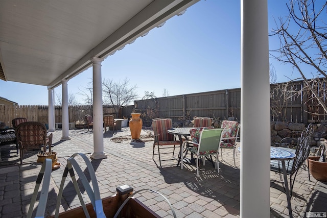7117 Mustengo Dr, Reno, NV 89506 - view of patio / terrace with outdoor dining space and a fenced backyard