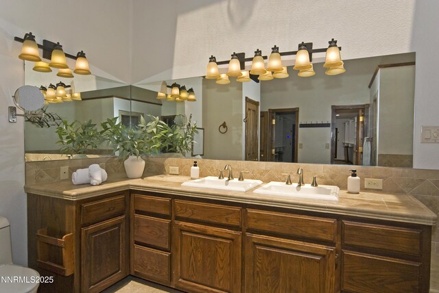205 Scotch Pine Rd, Reno, NV 89511 - full bath with double vanity, tasteful backsplash, and toilet