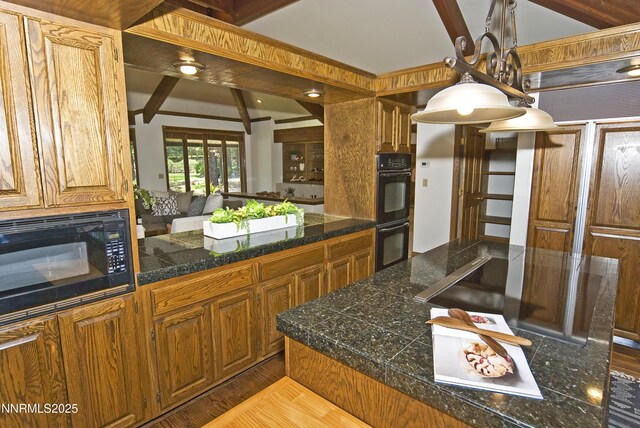 205 Scotch Pine Rd, Reno, NV 89511 - kitchen featuring tile counters, black appliances, brown cabinetry, beam ceiling, and hanging light fixtures