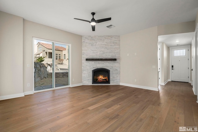 2665 Rockview Dr, Reno, NV 89519 - unfurnished living room with a ceiling fan, hardwood / wood-style flooring, a fireplace, and baseboards