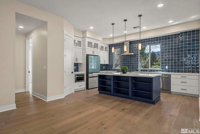 2665 Rockview Dr, Reno, NV 89519 - kitchen with stainless steel appliances, open shelves, tasteful backsplash, light countertops, and recessed lighting