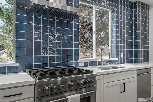 2665 Rockview Dr, Reno, NV 89519 - kitchen featuring stainless steel appliances, a sink, decorative backsplash, and light countertops