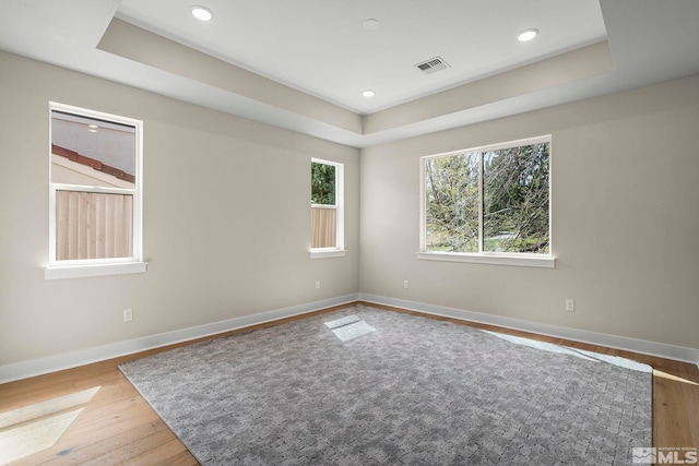 2665 Rockview Dr, Reno, NV 89519 - empty room with a raised ceiling, wood finished floors, baseboards, and recessed lighting