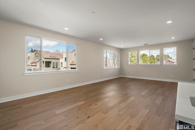 2665 Rockview Dr, Reno, NV 89519 - unfurnished living room with wood finished floors, recessed lighting, and baseboards