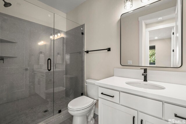 2665 Rockview Dr, Reno, NV 89519 - bathroom featuring toilet, a stall shower, and vanity