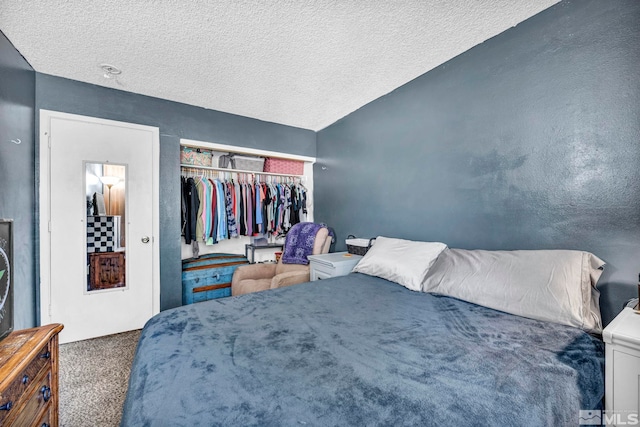785 Kingston Ln Unit E, Reno, NV 89511 - bedroom with carpet floors, a textured ceiling, a closet, and vaulted ceiling