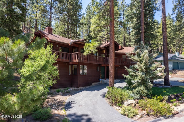513 Lucille Dr, Incline Village, NV 89451 - rustic home with driveway and a chimney