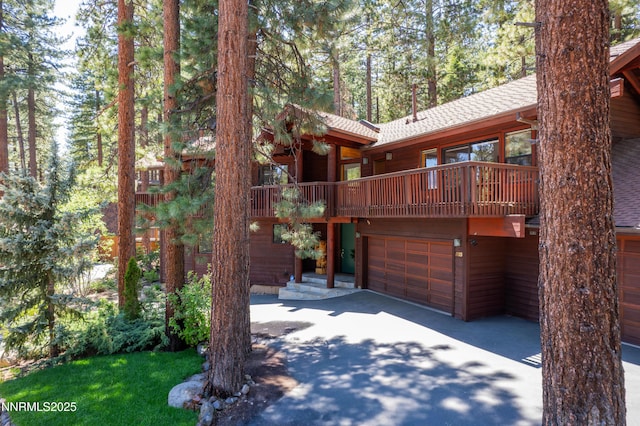 513 Lucille Dr, Incline Village, NV 89451 - rustic home featuring a shingled roof, a balcony, and a garage
