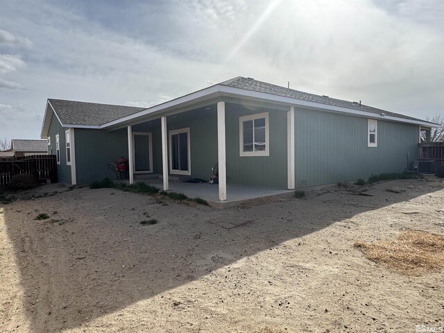 794 Megan Way, Fallon, NV 89406 - back of house with a patio area, fence, and roof with shingles