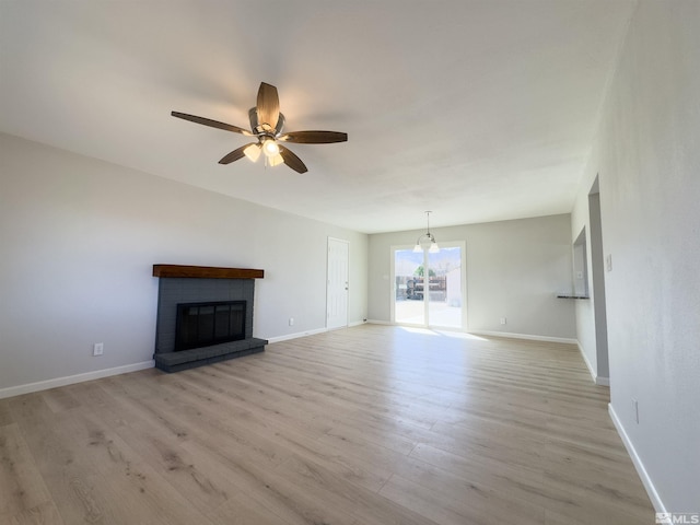675 L St, Hawthorne, NV 89415 - unfurnished living room featuring a ceiling fan, light wood-style flooring, and baseboards