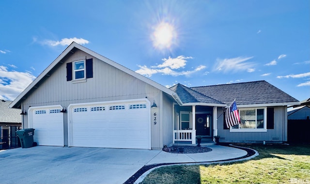 629 Ross St, Winnemucca, NV 89445 - ranch-style home with a garage, driveway, a front yard, and roof with shingles