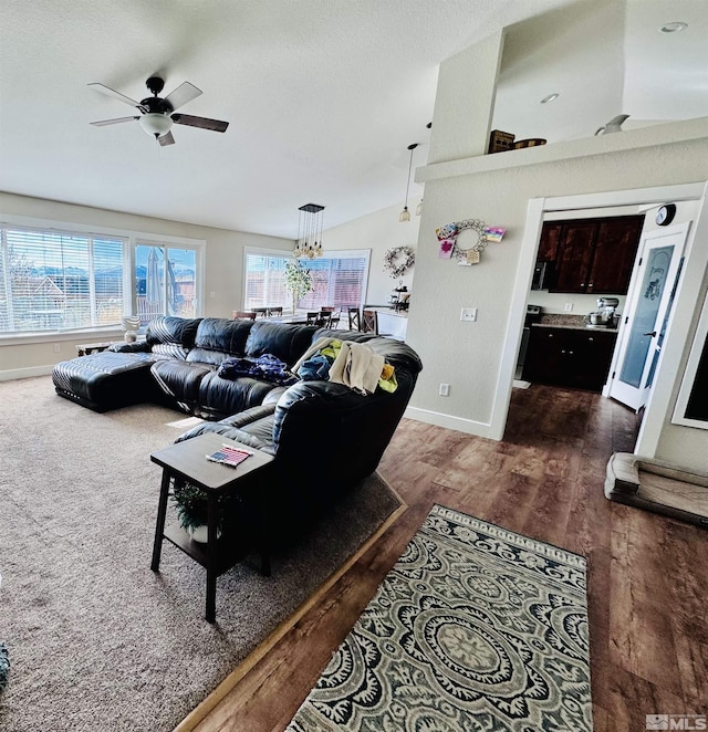 629 Ross St, Winnemucca, NV 89445 - living room with a ceiling fan, vaulted ceiling, wood finished floors, and baseboards