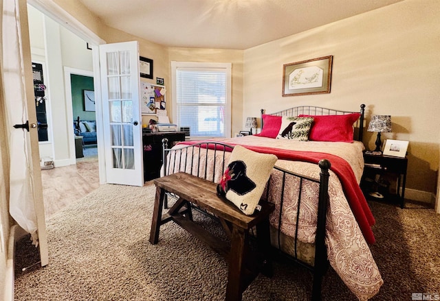 629 Ross St, Winnemucca, NV 89445 - carpeted bedroom featuring french doors and baseboards