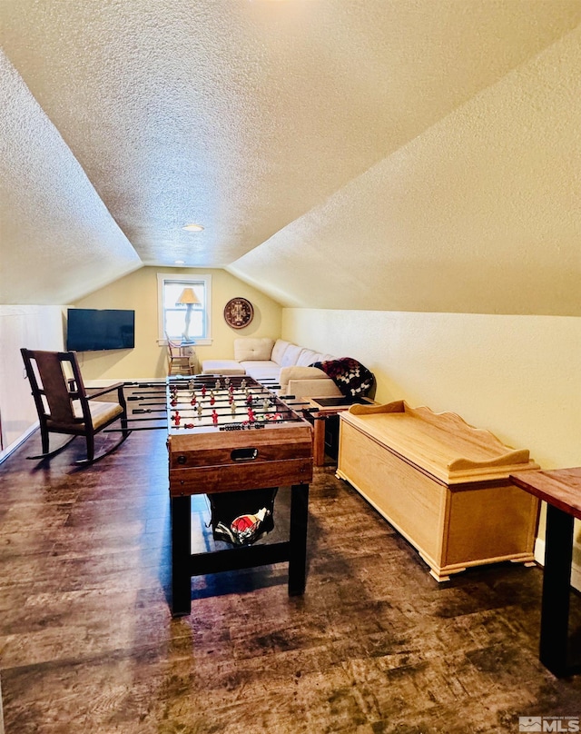 629 Ross St, Winnemucca, NV 89445 - rec room featuring a textured ceiling, lofted ceiling, and wood finished floors