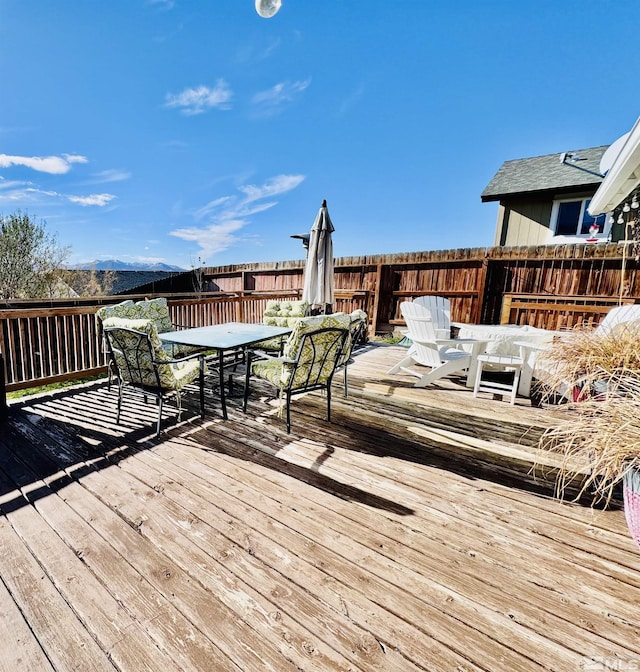 629 Ross St, Winnemucca, NV 89445 - wooden deck with outdoor dining space and fence