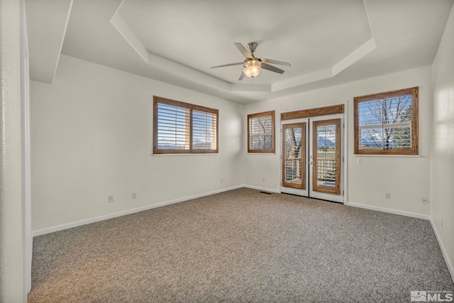 1568 Barker Ct, Gardnerville, NV 89410 - carpeted empty room with a raised ceiling, ceiling fan, baseboards, and french doors