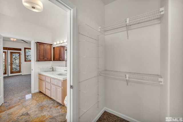 1568 Barker Ct, Gardnerville, NV 89410 - full bath featuring a walk in closet, double vanity, and baseboards