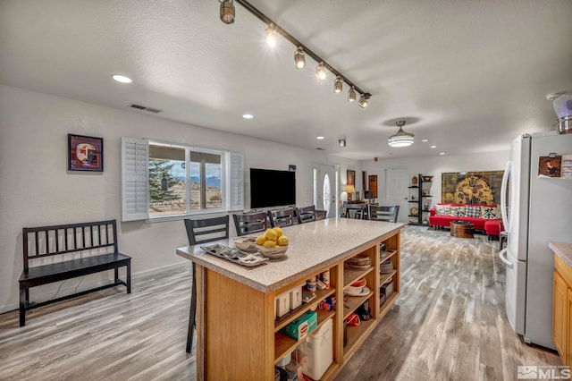 1568 Barker Ct, Gardnerville, NV 89410 - kitchen with freestanding refrigerator, open shelves, open floor plan, light wood-type flooring, and recessed lighting