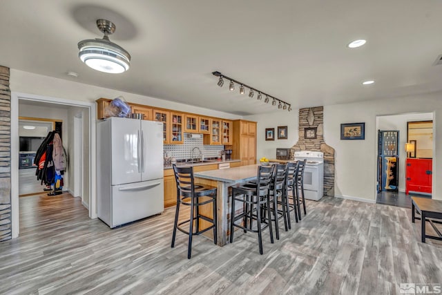 1568 Barker Ct, Gardnerville, NV 89410 - dining room featuring light wood-style flooring, baseboards, recessed lighting, and track lighting