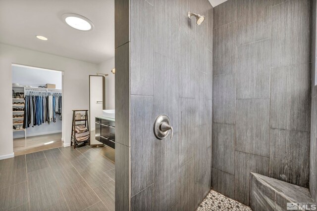 1568 Barker Ct, Gardnerville, NV 89410 - full bath with tiled shower, vanity, and a spacious closet
