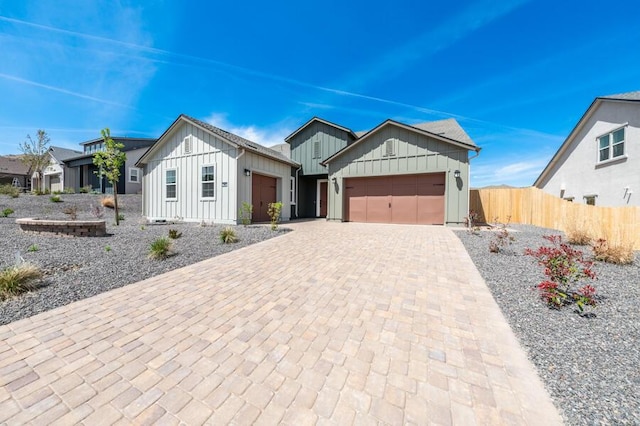 2983 Murrelet Way Unit Cinmon 169, Sparks, NV 89441 - modern farmhouse style home featuring board and batten siding, an attached garage, fence, and decorative driveway