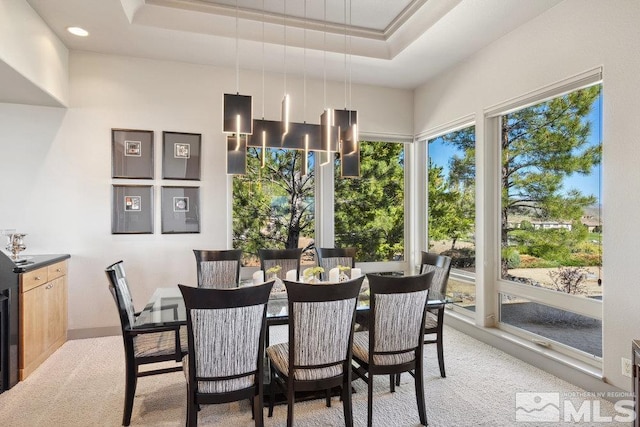 4020 Cocopah Ct, Reno, NV 89511 - dining area with light carpet and a tray ceiling