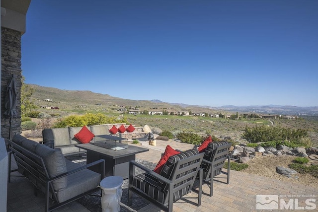 4020 Cocopah Ct, Reno, NV 89511 - view of patio with a mountain view and a fire pit